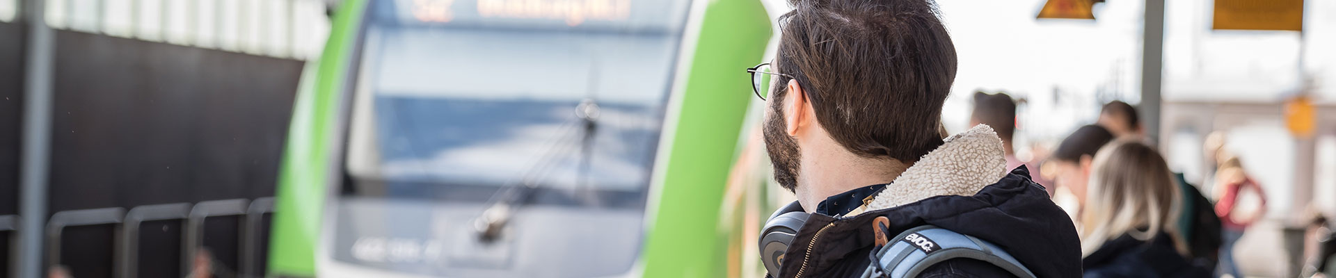 A man looking to the arriving train